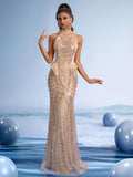 Gold sequin halter neck mermaid evening gown with crystal beading and backless design for gala or formal prom.