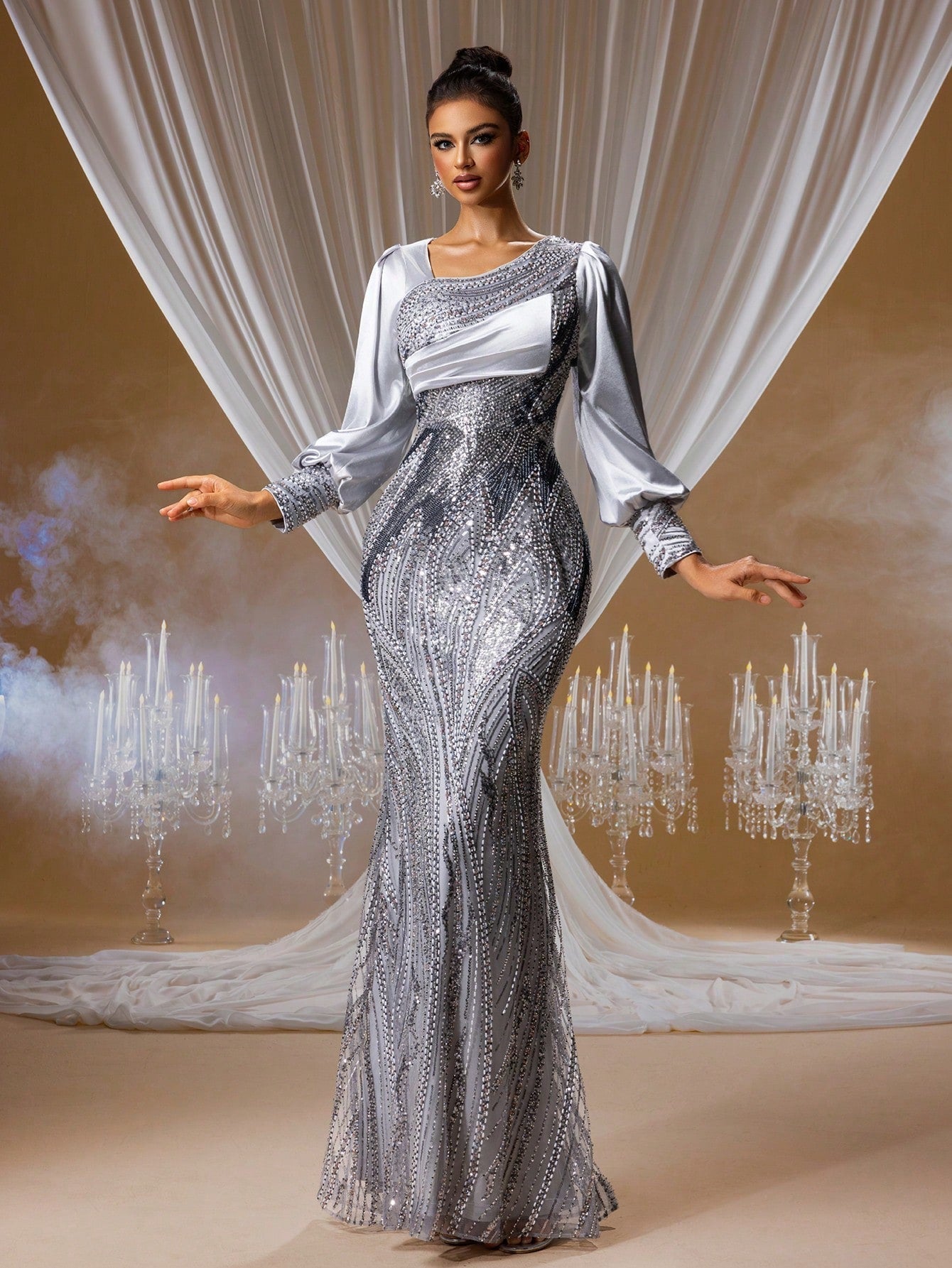 Silver sequin mermaid evening gown with a draped one-shoulder satin panel, elegant lantern sleeves, and intricate crystal embroidery for red carpet events.