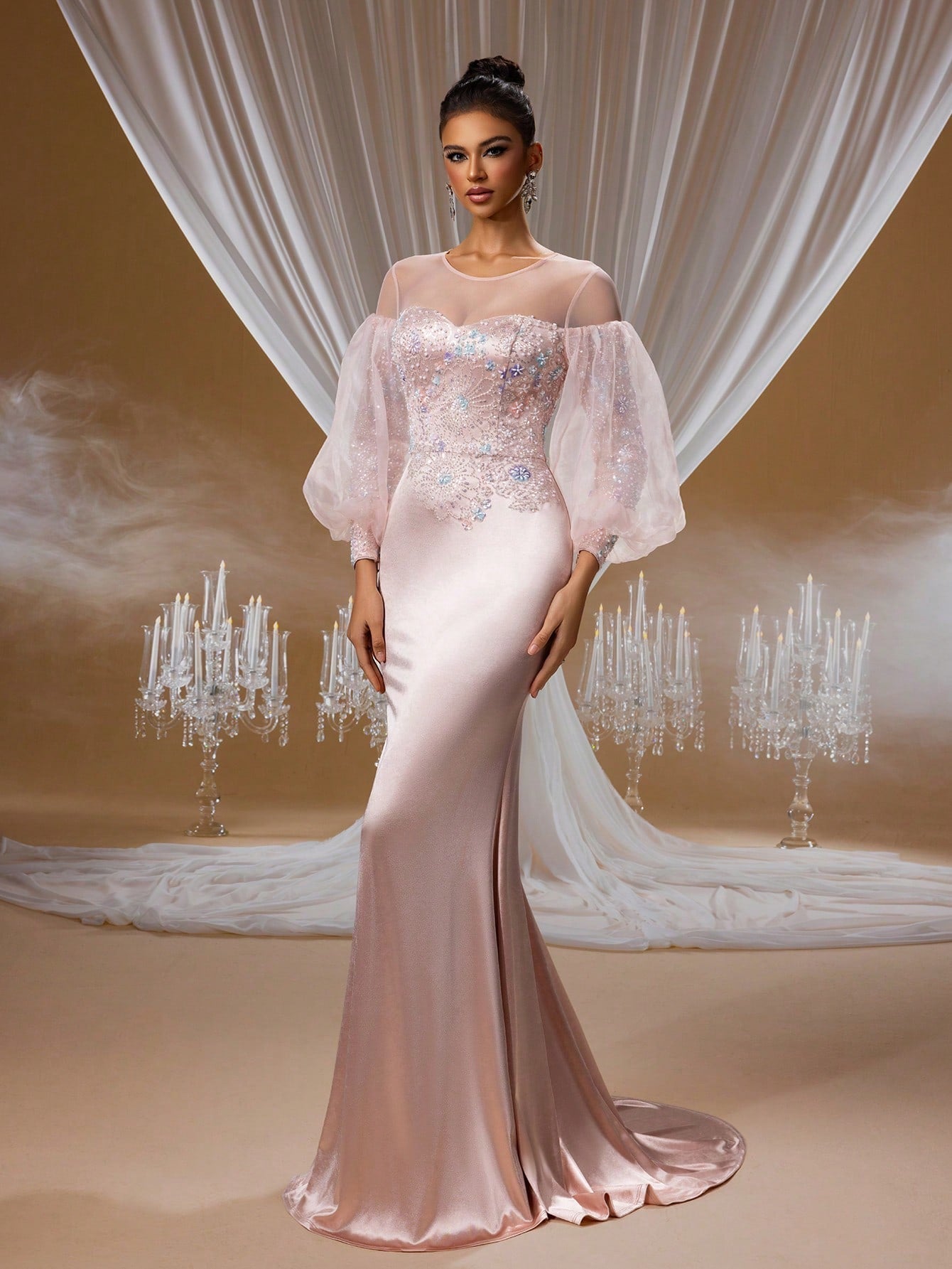 Blush pink crystal embroidered mermaid evening gown with puffy sheer tulle sleeves, illusion neckline, and a figure-hugging satin skirt for formal galas or proms.