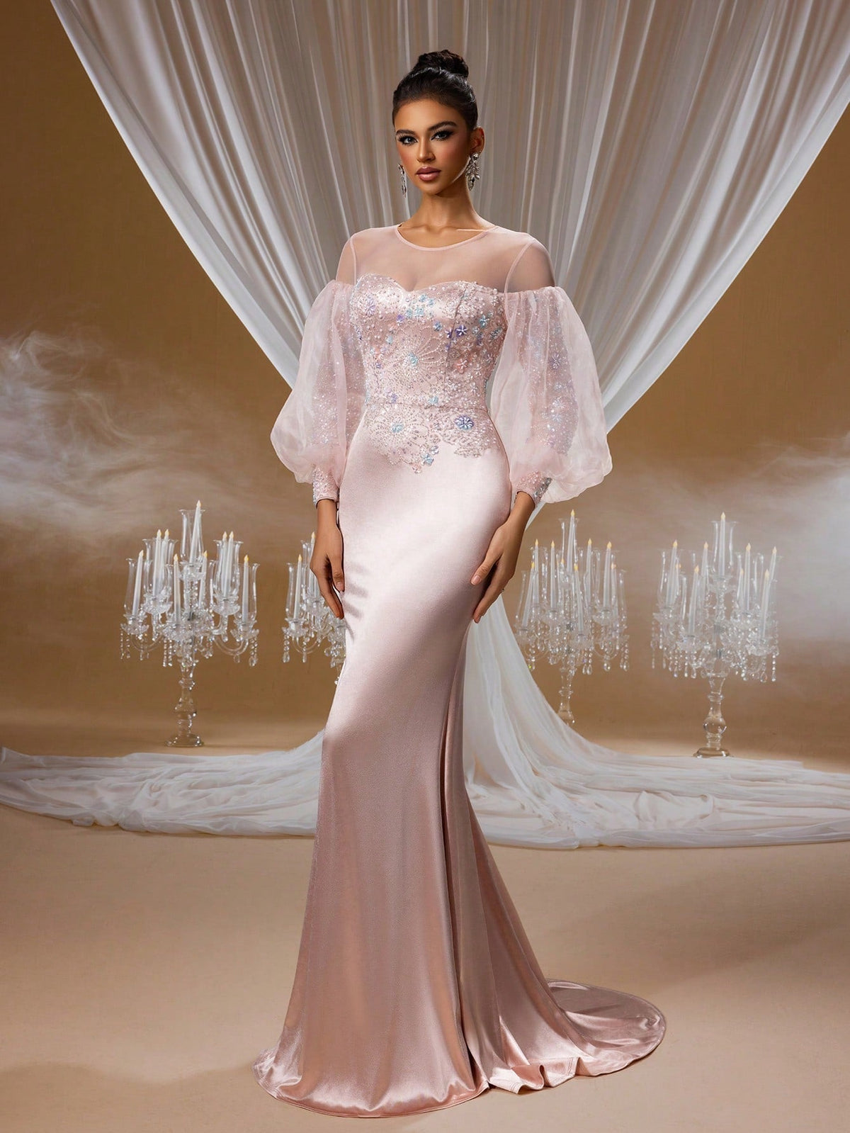 Blush pink crystal embroidered mermaid evening gown with puffy sheer tulle sleeves, illusion neckline, and a figure-hugging satin skirt for formal galas or proms.