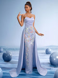 Lilac floral beaded mermaid evening gown with thin spaghetti straps and a flowing detachable cape train for formal weddings or proms.
