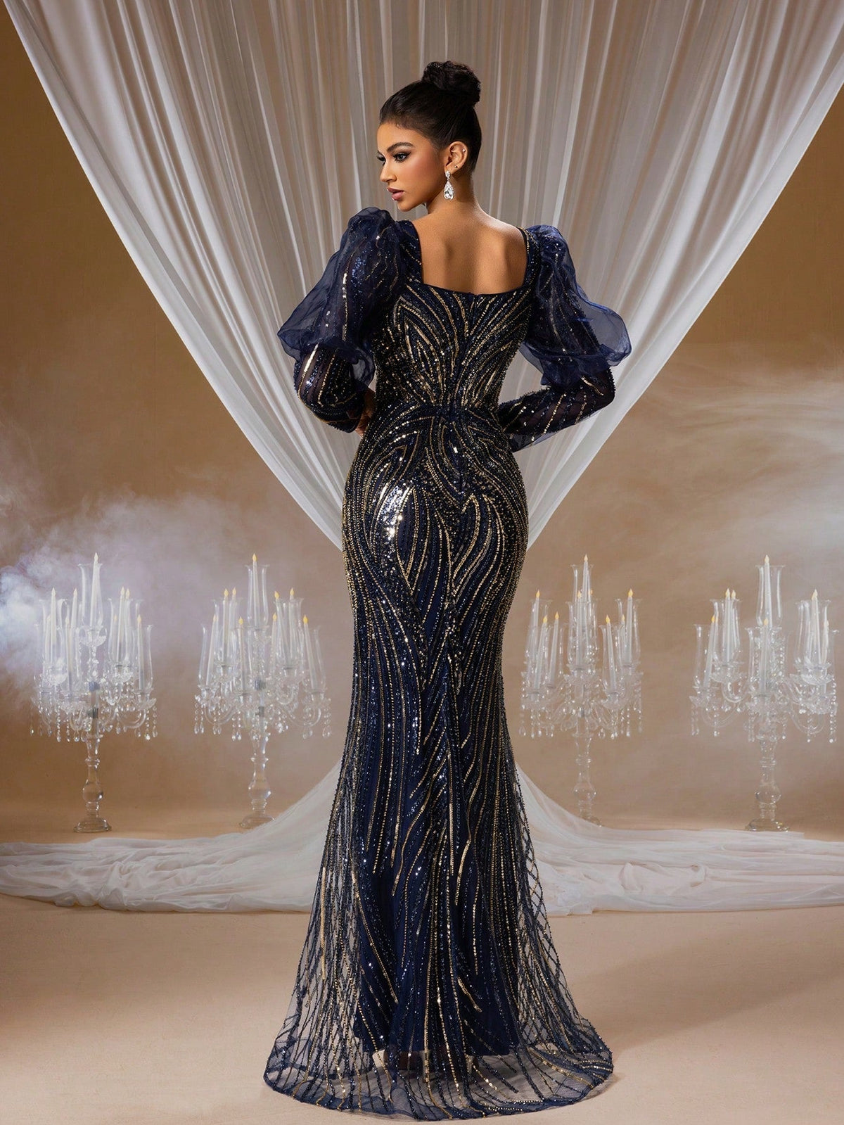 Midnight sapphire and gold sequin mermaid evening gown with dramatic 3D bubble sleeves, sweetheart neckline, and intricate hand-beaded embroidery for formal galas.